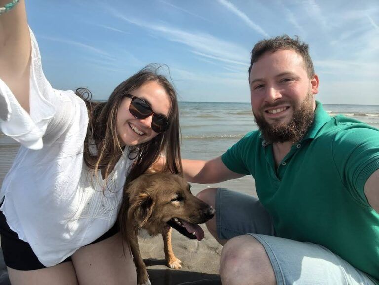 Golden dog Donut enjoying the beach in France after relocation.