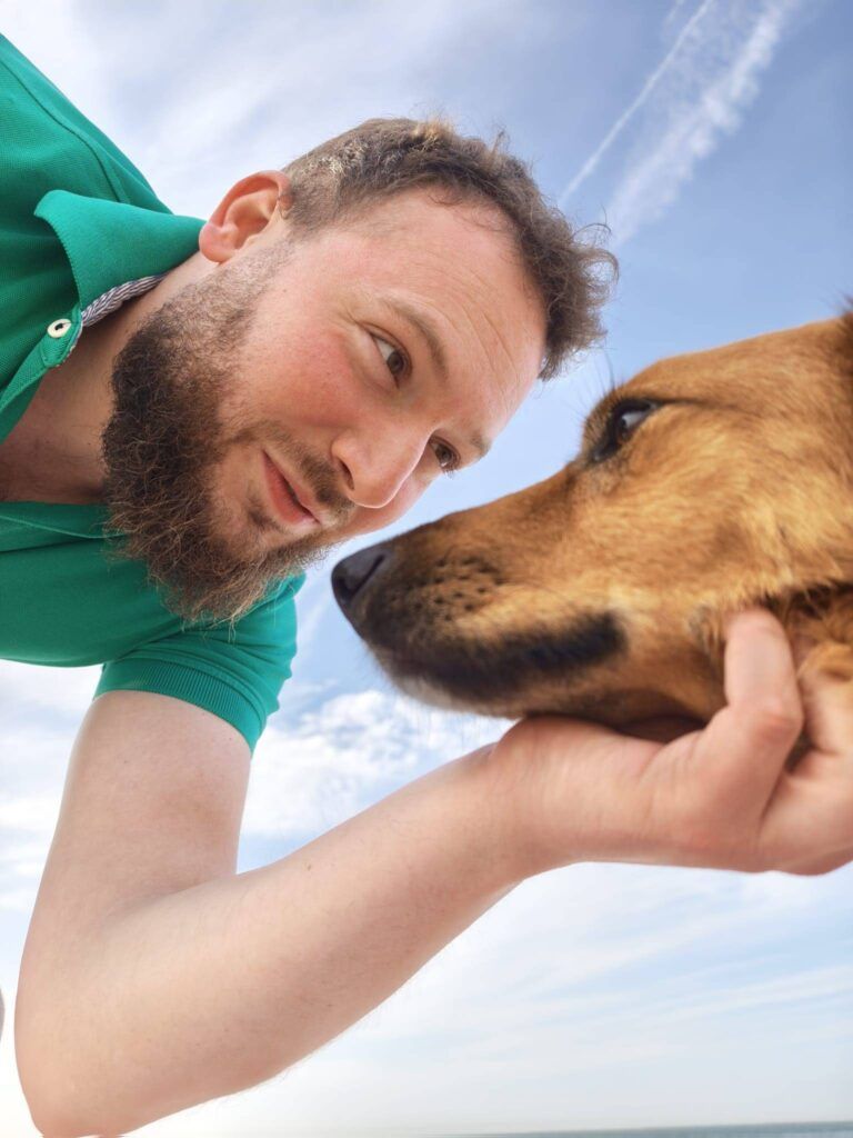 Golden dog Donut enjoying the beach in France after relocation.